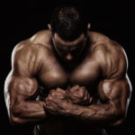Body builder big lean muscular arms and shoulders